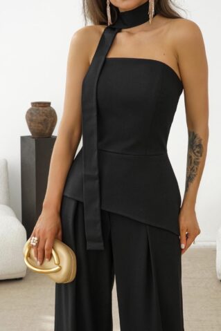 Elegantne naiste pükskostüüm mustas toonis kaheosaline komplekt.