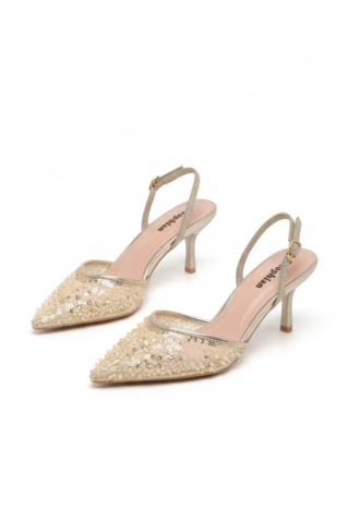 Kuldsed sädelusega naiste kontsakingad glamuurseks peoks ja lõpetamiseks.